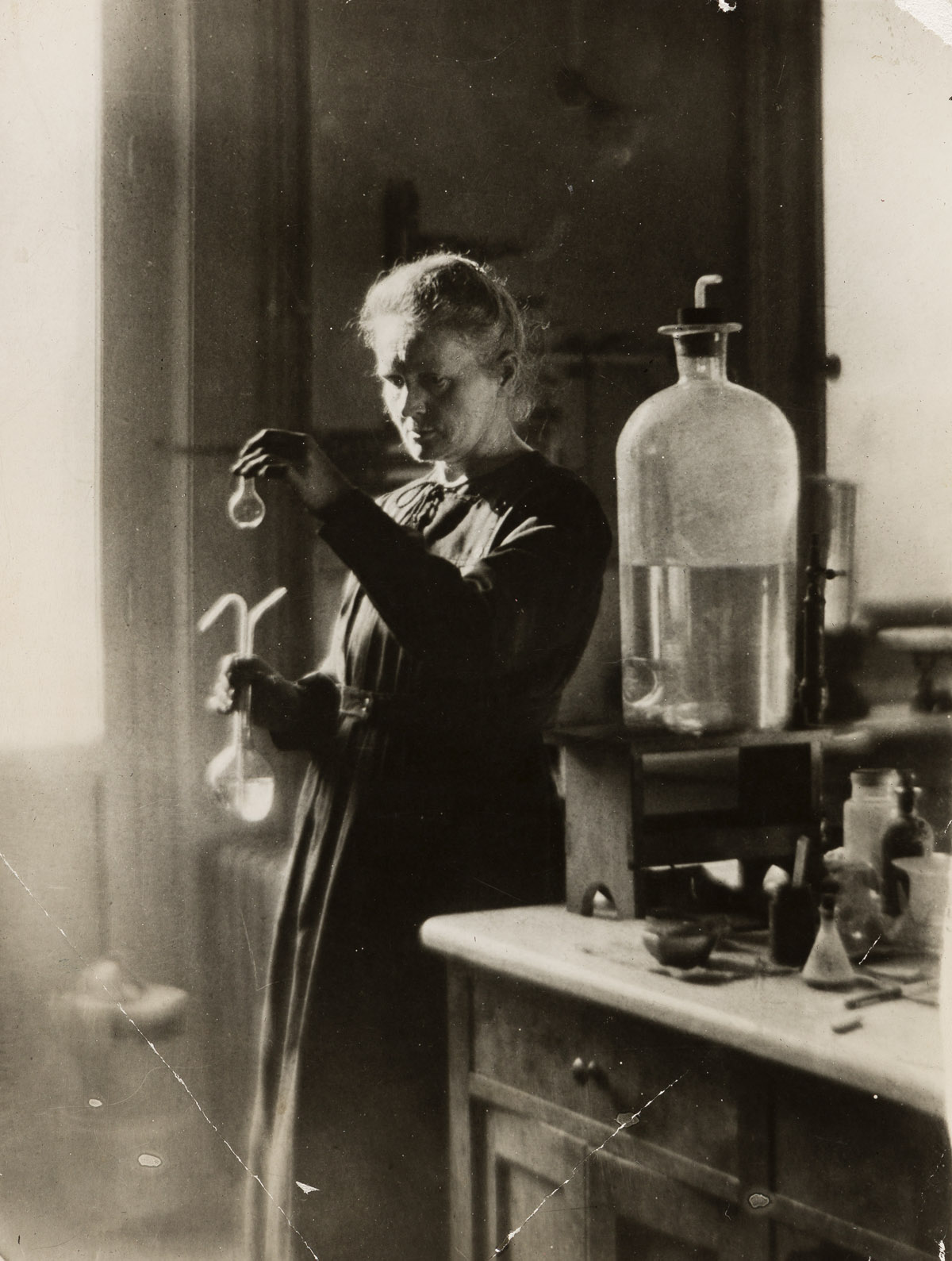 (MADAME CURIE--RADIUM) A group of 6 photographs depicting the Nobel Prize-winning chemist and physicist and her husband and daughter.